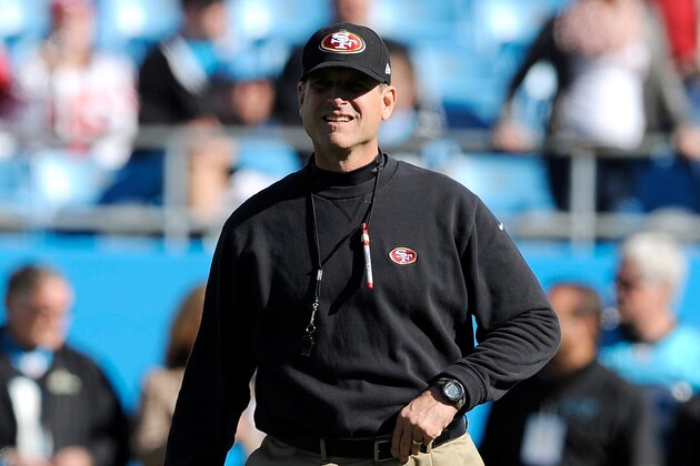 CHARLOTTE, NC - JANUARY 12: Head coach Jim Harbaugh of the San Francisco 49ers walks on the field prior to the NFC Divisional Playoff Game against the Carolina Panthers at Bank of America Stadium on January 12, 2014 in Charlotte, North Carolina.  (Photo by Grant Halverson/Getty Images)