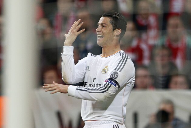 Real's Cristiano Ronaldo celebrates scoring his side's 3rd goal during the Champions League semifinal second leg soccer match between Bayern Munich and Real Madrid at the Allianz Arena in Munich, southern Germany, Tuesday, April 29, 2014. (AP Photo/Matthias Schrader)