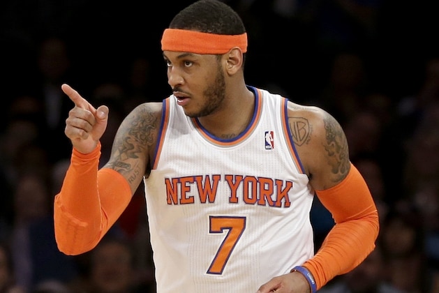 New York Knicks' Carmelo Anthony points after sinking a basket during the first half against the Indiana Pacers in an NBA basketball game at Madison Square Garden, Wednesday, March 19, 2014, in New York. (AP Photo/Seth Wenig)