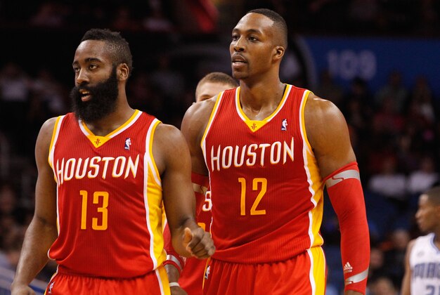 Mar 5, 2014; Orlando, FL, USA; Houston Rockets shooting guard James Harden (13) and Houston Rockets center Dwight Howard (12) against the Orlando Magic  during the second half at Amway Center. Houston Rockets defeated the Orlando Magic 101-89. Mandatory Credit: Kim Klement-USA TODAY Sports