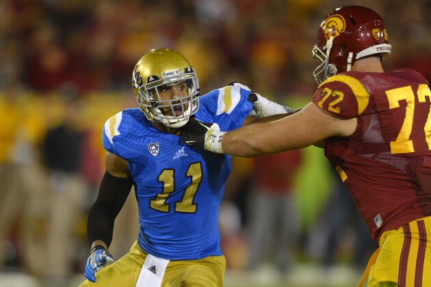 UCLA linebacker Anthony Barr, left, tries to get by Southern California offensive tackle Chad Wheeler during the first half of an NCAA college football game, Saturday, Nov. 30, 2013, in Los Angeles. (AP Photo/Mark J. Terrill)