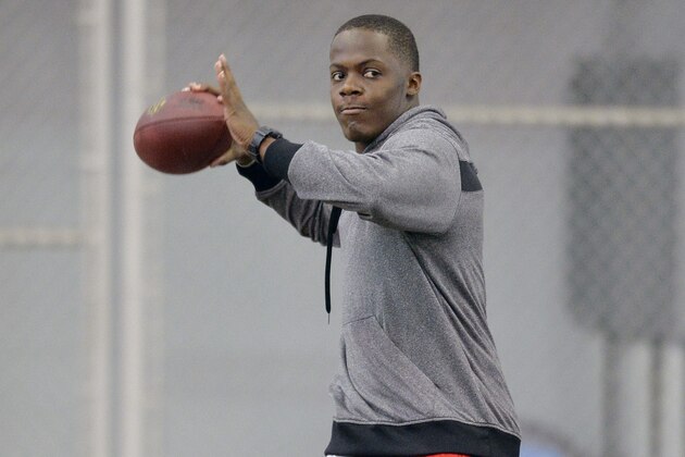 Louisville quarterback Teddy Bridgewater warms up before participating in passing drills for NFL representatives during pro day at the University of Louisville in Louisville, Ky., Monday, March 17, 2014. (AP Photo/Timothy D. Easley)