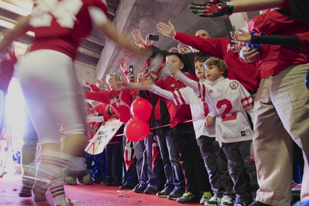 Nebraska fans try to touch players running onto the field prior to the first half of an NCAA college football game against Michigan State in Lincoln, Neb., Saturday, Nov. 16, 2013. (AP Photo/Nati Harnik) Nebraska fans try to touch players running onto the field prior to the first half of an NCAA college football game against Michigan State in Lincoln, Neb., Saturday, Nov. 16, 2013. (AP Photo/Nati Harnik)