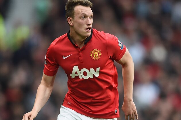 MANCHESTER, ENGLAND - APRIL 26:  Phil Jones of Machester United in action during the Barclays Premier League match between Manchester United and Norwich City at Old Trafford on April 26, 2014 in Manchester, England.  (Photo by Laurence Griffiths/Getty Images)