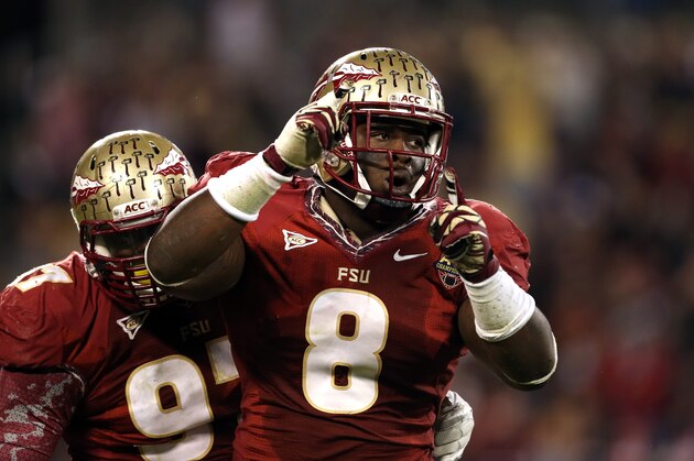 CHARLOTTE, NC - DECEMBER 01:  Timmy Jernigan #8 of the Florida State Seminoles reacts after a sack against the Georgia Tech Yellow Jackets during the 2012 ACC Championship game at Bank of America Stadium on December 1, 2012 in Charlotte, North Carolina.  (Photo by Streeter Lecka/Getty Images)