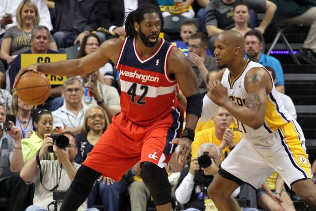 May 7, 2014; Indianapolis, IN, USA; Washington Wizards forward Nene (42) is guarded by Indiana Pacers forward David West (21) in game two of the second round of the 2014 NBA Playoffs at Bankers Life Fieldhouse.  Indiana defeats Washington 86-82. Mandatory Credit: Brian Spurlock-USA TODAY Sports