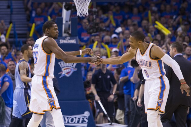 OKLAHOMA CITY, OK - May 3, 2014: Kevin Durant #35 and Russell Westbrook #0 of the Oklahoma City Thunder celebrate during a game against the Memphis Grizzlies in Game 7 of the Western Conference Quarterfinals during the 2014 NBA Playoffs at the Chesapeake Arena on May 3, 2014 in Oklahoma City, Oklahoma. NOTE TO USER:  User expressly acknowledges and agrees that, by downloading and/or using this photograph, user is consenting to the terms and conditions of the Getty Images License Agreement. Mandatory Copyright Notice:  Copyright 2014 NBAE (Photo by Richard Rowe/NBAE via Getty Images)