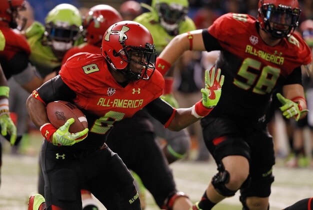 Jan 2, 2014; St. Petersburg, FL, USA; Team Highlight running back Racean Thomas (8) stiff arms during the second half at Tropicana Field. Team Highlight defeated the Team Nitro 31-21. Mandatory Credit: Kim Klement-USA TODAY Sports