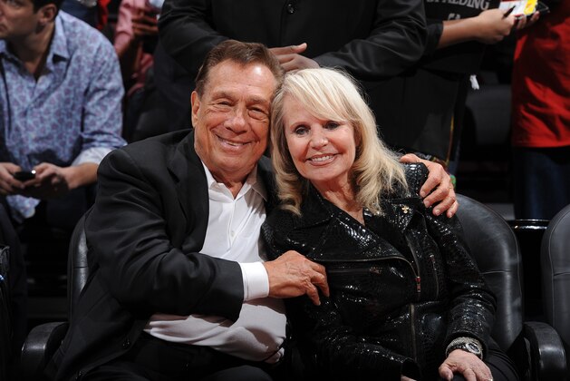 LOS ANGELES, CA - MAY 7:  Donald Sterling, owner of the Los Angeles Clippers, left and his wife Shelly pose for a photograph before his team played the Memphis Grizzlies in Game Four of the Western Conference Quarterfinals during the 2012 NBA Playoffs at Staples Center on May 7, 2012 in Los Angeles, California. NOTE TO USER: User expressly acknowledges and agrees that, by downloading and/or using this Photograph, user is consenting to the terms and conditions of the Getty Images License Agreement. Mandatory Copyright Notice: Copyright 2012 NBAE (Photo by Andrew D. Bernstein/NBAE via Getty Images)