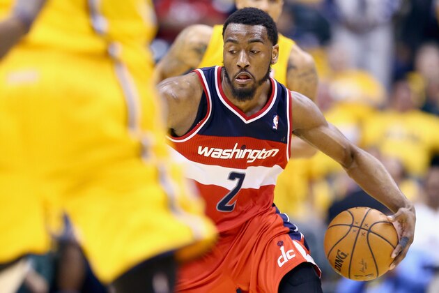 INDIANAPOLIS, IN - MAY 05: John Wall #2 of the Washington Wizards dribbles the ball against the Indiana Pacers  in Game 1 of the Eastern Conference Semifinals during the 2014 NBA Playoffs at Bankers Life Fieldhouse on May 5, 2014 in Indianapolis, Indiana. NOTE TO USER: User expressly acknowledges and agrees that, by downloading and or using this photograph, User is consenting to the terms and conditions of the Getty Images License Agreement.  (Photo by Andy Lyons/Getty Images)