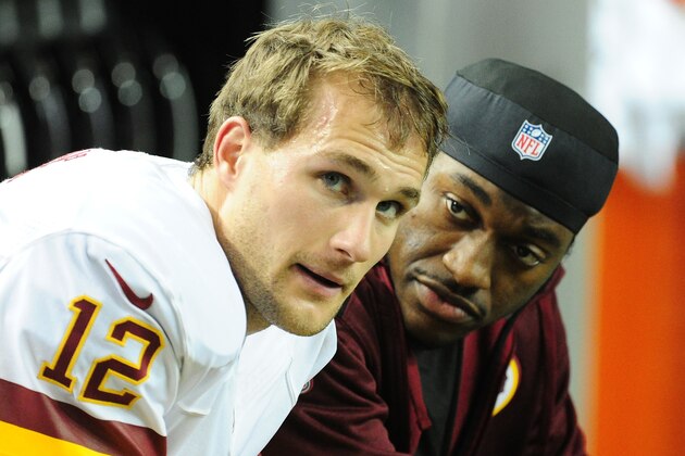 ATLANTA, GA - DECEMBER 15: Kirk Cousins #12 of the Washington Redskins chats with Robert Griffin III after throwing a 4th quarter interception against the Atlanta Falcons at the Georgia Dome on December 15, 2013 in Atlanta, Georgia. (Photo by Scott Cunningham/Getty Images)