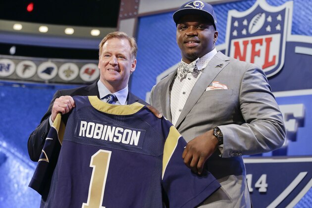 Auburn tackle Greg Robinson, right, poses with NFL commissioner Roger Goodell after being chosen by the St. Louis Rams as the second pick in the first round of the 2014 NFL Draft, Thursday, May 8, 2014, in New York. (AP Photo/Craig Ruttle)