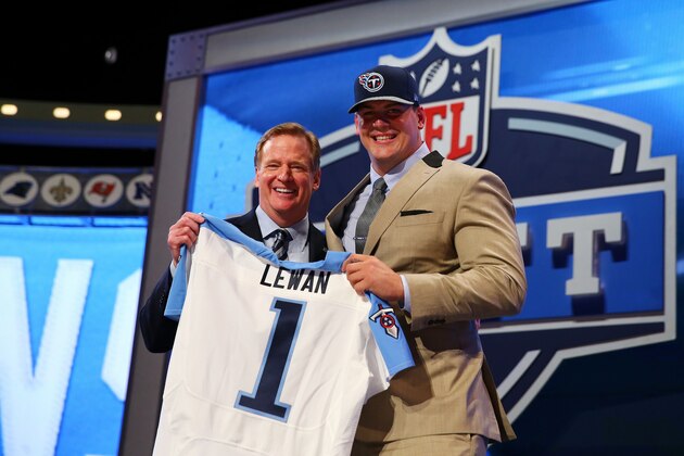 NEW YORK, NY - MAY 08:  Taylor Lewan of the Michigan Wolverines poses with NFL Commissioner Roger Goodell after he was picked #11 overall by the during the first round of the 2014 NFL Draft at Radio City Music Hall on May 8, 2014 in New York City.  (Photo by Elsa/Getty Images)