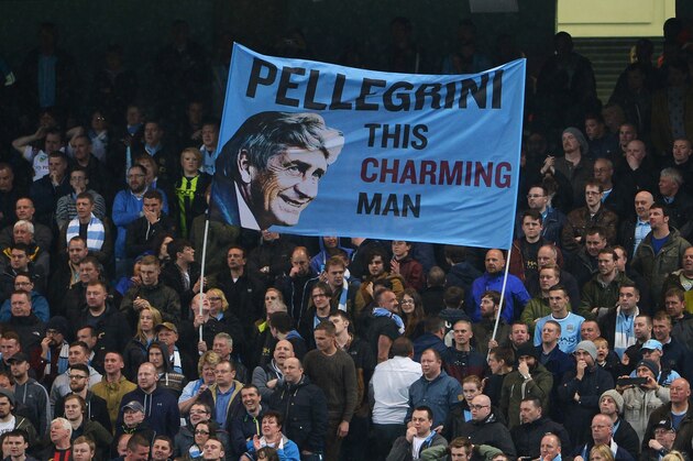 MANCHESTER, ENGLAND - MAY 07: Manchester City fans fly a flag for Manuel Pellegrini, manager of Manchester City during the Barclays Premier League match between Manchester City and Aston Villa at Etihad Stadium on May 7, 2014 in Manchester, England.  (Photo by Michael Regan/Getty Images)