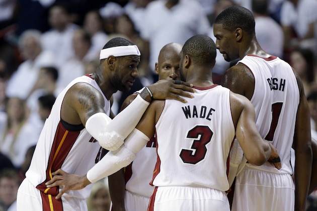 Miami Heat's LeBron James, left, Dwyane Wade (3), Chris Bosh (1) and Ray Allen, center, huddle on the court in the second half of Game 1 in an NBA basketball Eastern Conference semifinal playoff series against the Brooklyn Nets, Tuesday, May 6, 2014, in Miami. The Heat defeated the Nets 107-86. (AP Photo/Lynne Sladky)