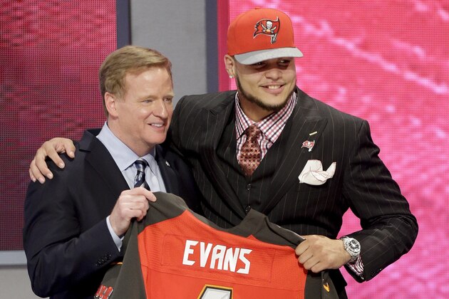 Texas A&M wide receiver Mike Evans poses with NFL commissioner after being chosen by the Tampa Bay Buccaneers as the seventh pick in  the first round of the 2014 NFL Draft, Thursday, May 8, 2014, in New York. (AP Photo/Frank Franklin II)
