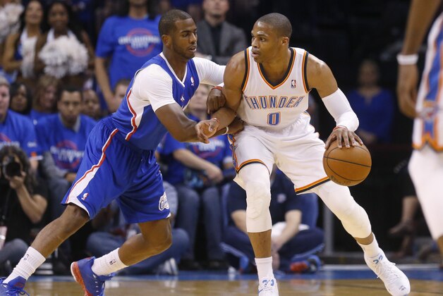 Oklahoma City Thunder guard Russell Westbrook (0) drives against Los Angeles Clippers guard Chris Paul (3) in the first quarter of Game 1 of the Western Conference semifinal NBA basketball playoff series in Oklahoma City, Monday, May 5, 2014. Los Angeles won 122-105. (AP Photo/Sue Ogrocki)