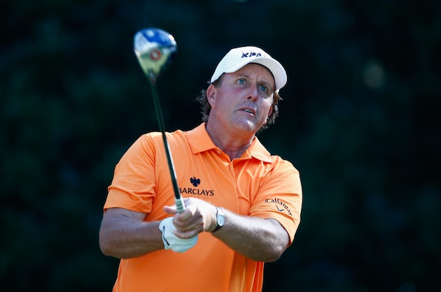 PONTE VEDRA BEACH, FL - MAY 08:  Phil Mickelson of the United States watches his tee shot on the 11th hole during the first round of THE PLAYERS Championship on The Stadium Course at TPC Sawgrass on May 8, 2014 in Ponte Vedra Beach, Florida.  (Photo by Sam Greenwood/Getty Images)