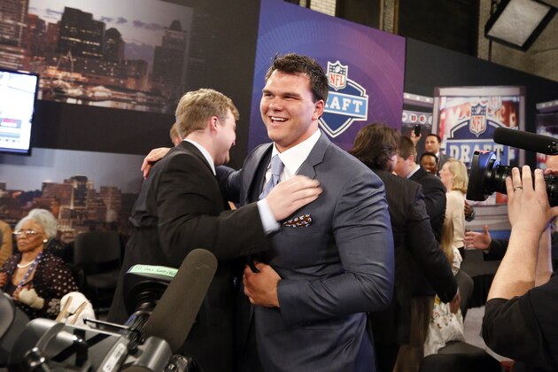 Jake Matthews, from Texas A&M, is congratulated after being selected sixth overall by the Atlanta Falcons in the first round of the NFL football draft, Thursday, May 8, 2014, at Radio City Music Hall in New York. (AP Photo/Jason DeCrow)