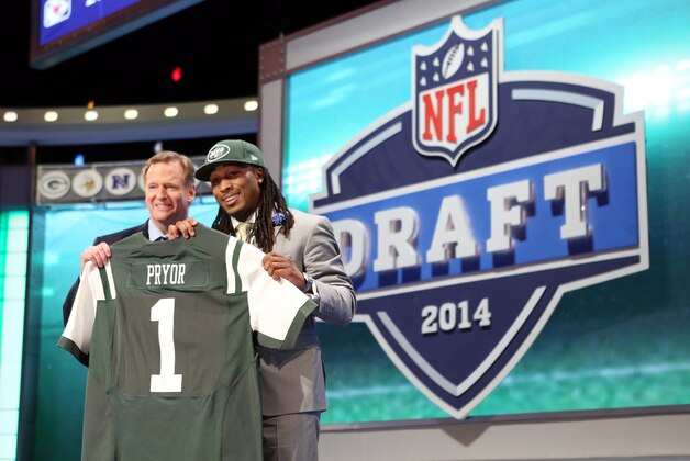 May 8, 2014; New York, NY, USA; Calvin Pryor (Louisville) poses for a photo with commissioner Roger Goodell after being selected as the number eighteen overall pick in the first round of the 2014 NFL Draft to the New York Jets at Radio City Music Hall. Mandatory Credit: Adam Hunger-USA TODAY Sports