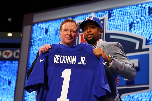 NEW YORK, NY - MAY 08:  Odell Beckham Jr of the LSU Tigers poses with NFL Commissioner Roger Goodell after he was picked #12 overall by the New York Giants during the first round of the 2014 NFL Draft at Radio City Music Hall on May 8, 2014 in New York City.  (Photo by Elsa/Getty Images)
