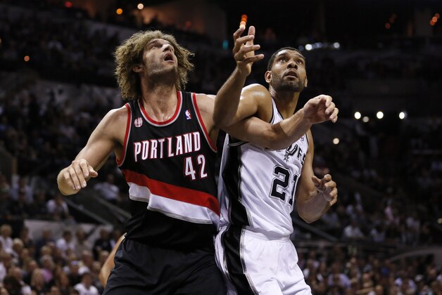 May 8, 2014; San Antonio, TX, USA; Portland Trail Blazers center Robin Lopez (42) and San Antonio Spurs forward Tim Duncan (21) battle for rebounding position in game two of the second round of the 2014 NBA Playoffs at AT&T Center. Mandatory Credit: Soobum Im-USA TODAY Sports