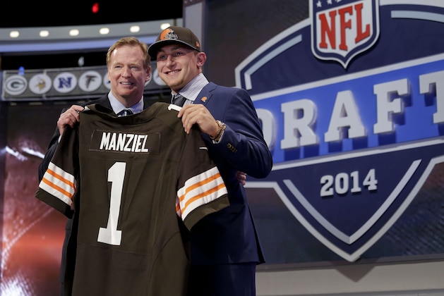 Texas A&M quarterback Johnny Manziel poses with NFL commissioner Roger Goodell after being selected by the Cleveland Browns as the 22nd pick in the first round of the 2014 NFL Draft, Thursday, May 8, 2014, in New York. (AP Photo/Craig Ruttle)