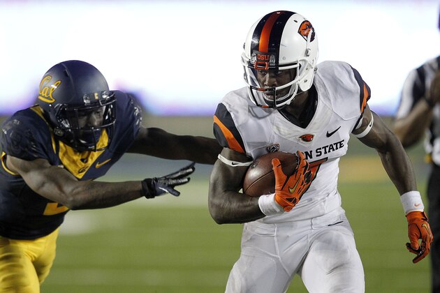 Oregon State wide receiver Brandin Cooks (7) runs past California defensive back Kameron Jackson (3) during the second half of an NCAA college football game in Berkeley, Calif., Saturday, Oct. 19, 2013. (AP Photo/Tony Avelar)