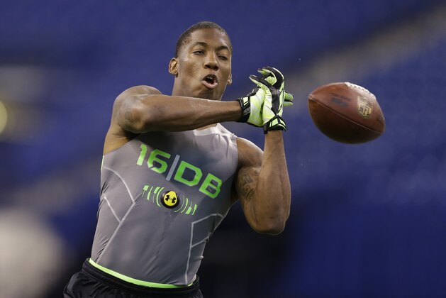 Michigan State defensive back Darqueze Dennard runs a drill at the NFL football scouting combine in Indianapolis, Tuesday, Feb. 25, 2014. (AP Photo/Michael Conroy)