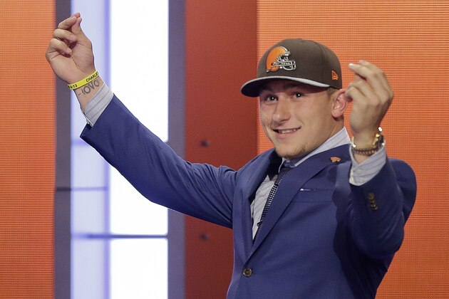 Texas A&M quarterback Johnny Manziel reacts after being selected by the Cleveland Browns as the 22nd pick in the first round of the 2014 NFL Draft, Thursday, May 8, 2014, in New York. (AP Photo/Frank Franklin II)