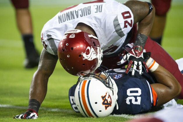 AUBURN, AL - AUGUST 31: Safety Deone Bucannon #20 of the Washington State Cougars lies on running back Corey Grant #20 of the Auburn Tigers after tackling him during the second half of play on August 31, 2013 at Jordan-Hare Stadium in Auburn, Alabama. Auburn defeated Washington State 31-24. (Photo by Michael Chang/Getty Images) AUBURN, AL - AUGUST 31: Safety Deone Bucannon #20 of the Washington State Cougars lies on running back Corey Grant #20 of the Auburn Tigers after tackling him during the second half of play on August 31, 2013 at Jordan-Hare Stadium in Auburn, Alabama. Auburn defeated Washington State 31-24. (Photo by Michael Chang/Getty Images)