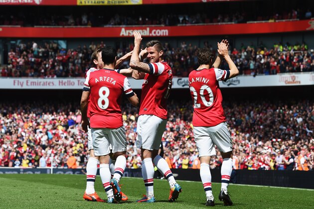 LONDON, ENGLAND - MAY 04:  Olivier Giroud (C) of Arsenal celebrates with team mates after scoring during the Barclays Premier League match between Arsenal and West Bromwich Albion at the Emirates Stadium on May 4, 2014 in London, England.  (Photo by Shaun Botterill/Getty Images)
