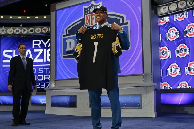 Ohio State outside linebacker Ryan Shazier poses for photos after being selected by the Pittsburgh Steelers as the 15th pick in the first round of the 2014 NFL Draft, Thursday, May 8, 2014, in New York. (AP Photo/Craig Ruttle)