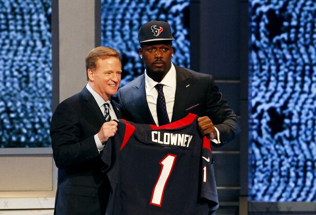 NEW YORK, NY - MAY 08:  Jadeveon Clowney of the South Carolina Gamecocks stands on stage with NFL Commissioner Roger Goodell after he was picked #1 overall by the Houston Texansduring the first round of the 2014 NFL Draft at Radio City Music Hall on May 8, 2014 in New York City.  (Photo by Cliff Hawkins/Getty Images)