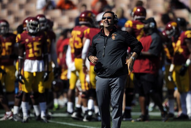 Apr 19, 2014; Los Angeles, CA, USA; Southern California head coach Steve Sarkisian (center) looks up during the Southern California Spring Game at Los Angeles Memorial Coliseum. Mandatory Credit: Kelvin Kuo-USA TODAY Sports