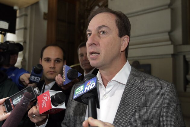 Joe Lacob, majority owner of the Golden State Warriors, is questioned by reporters outside New York's St. Regis Hotel, Thursday, April 18, 2013. Lacob is attending the annual NBA's Board of Governors meetings. (AP Photo/Richard Drew)
