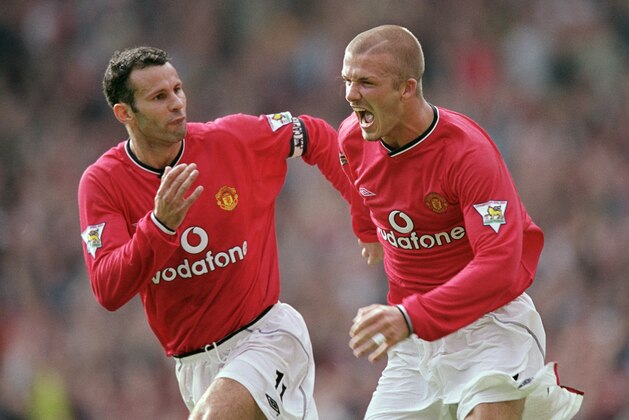 19 Aug 2001:  David Beckham of Manchester United celebrates scoring a freekick with team mate Ryan Giggs during the FA Barclaycard Premiership match against Fulham played at Old Trafford in Manchester, England.  Man Utd won the game 3 - 2. \ Mandatory Credit: Alex Livesey /Allsport
