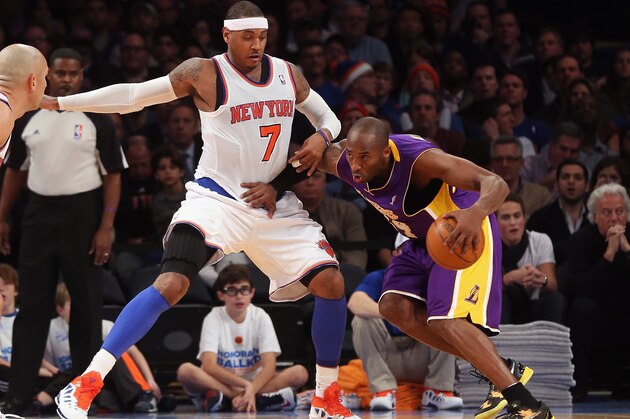 NEW YORK, NY - DECEMBER 13:  Kobe Bryant #24 of the Los Angeles Lakers plays against Carmelo Anthony #7 of the New York Knicks  at Madison Square Garden on December 13, 2012 in New York City. NOTE TO USER: User expressly acknowledges and agrees that, by downloading and/or using this photograph, user is consenting to the terms and conditions of the Getty Images License Agreement. The Knicks defeated the Lakers 116-107.  (Photo by Bruce Bennett/Getty Images)