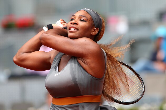 MADRID, SPAIN - MAY 07:  Serena Williams of USA in action against Shuai Peng of China during day five of the Mutua Madrid Open tennis tournament at the Caja Magica on May 7, 2014 in Madrid, Spain.  (Photo by Julian Finney/Getty Images)