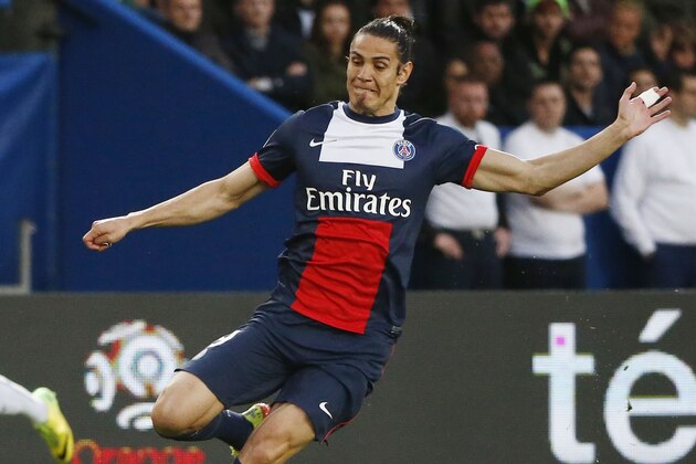Paris Saint Germain's Uruguayan Edinson Cavani, kicks the ball during a French league one soccer match between Paris-Saint-Germain and Rennes at Parc des Princes stadium in Paris, Wednesday, May 7, 2014. Paris Saint Germain clinched its second straight French league title on Wednesday after rival Monaco drew 1-1 against French Cup holder Guingamp. (AP Photo/Michel Euler)