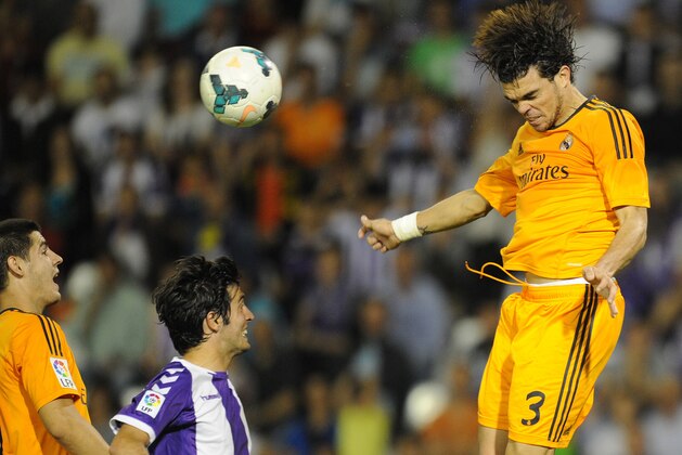 Real Madrid's Portuguese defender Pepe, right,  jumps for the ball during a Spanish La Liga soccer match against Real Valladolid,  at the Jose Zorrilla stadium in Valladolid, Spain, Wednesday, May 7, 2014. (AP Photo/Israel L. Murillo)