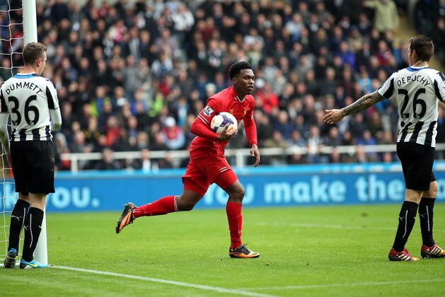 Liverpool's Daniel Sturridge, center, celebrates his goal  during their English Premier League soccer match against Newcastle United at St James' Park, Newcastle, England, Saturday, Oct. 19, 2013. (AP Photo/Scott Heppell)