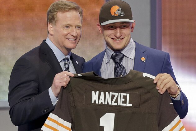Texas A&M quarterback Johnny Manziel poses with NFL commissioner Roger Goodell after being selected by the Cleveland Browns as the 22nd pick in the first round of the 2014 NFL Draft, Thursday, May 8, 2014, in New York.  (AP Photo/Frank Franklin II)