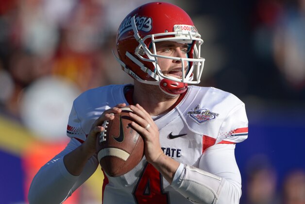 Dec 21, 2013; Las Vegas, NV, USA; Fresno State Bulldogs quarterback Derek Carr (4) throws a pass against the Southern California Trojans in the Las Vegas Bowl at Sam Boyd Stadium. Mandatory Credit: Kirby Lee-USA TODAY Sports