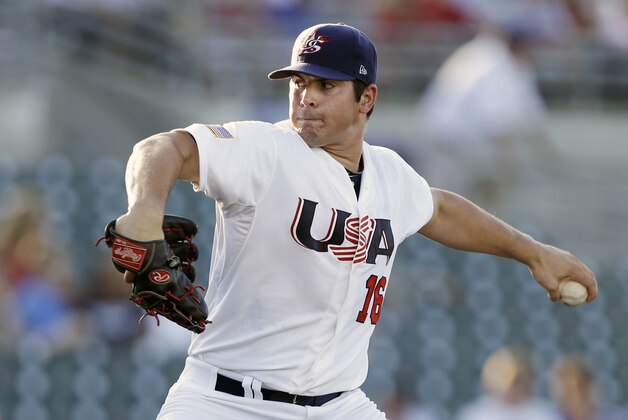 United States pitcher Carlos Rodon throws during the first inning of an exhibition game against Cuba, Thursday, July 18, 2013, in Des Moines, Iowa. (AP Photo/Charlie Neibergall)