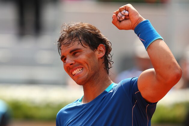 MADRID, SPAIN - MAY 08:  Rafael Nadal of Spain celebrates his straight sets victory against Jarkko Nieminen of Finland in their third round match during day six of the Mutua Madrid Open tennis tournament at the Caja Magica on May 8, 2014 in Madrid, Spain.  (Photo by Clive Brunskill/Getty Images)