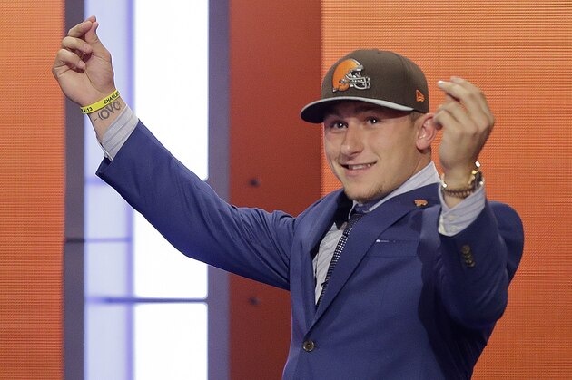Texas A&M quarterback Johnny Manziel reacts after being selected by the Cleveland Browns as the 22nd pick in the first round of the 2014 NFL Draft, Thursday, May 8, 2014, in New York. (AP Photo/Frank Franklin II)