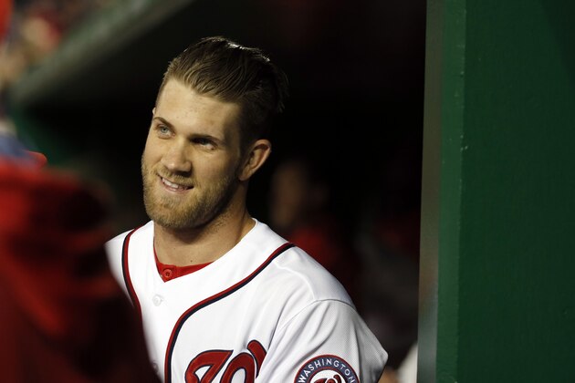Washington Nationals' Bryce Harper celebrates his three-run homer after the umpires review confirms the play during the fourth inning of a baseball game against the Miami Marlins at Nationals Park Wednesday, April 9, 2014, in Washington. (AP Photo/Alex Brandon)