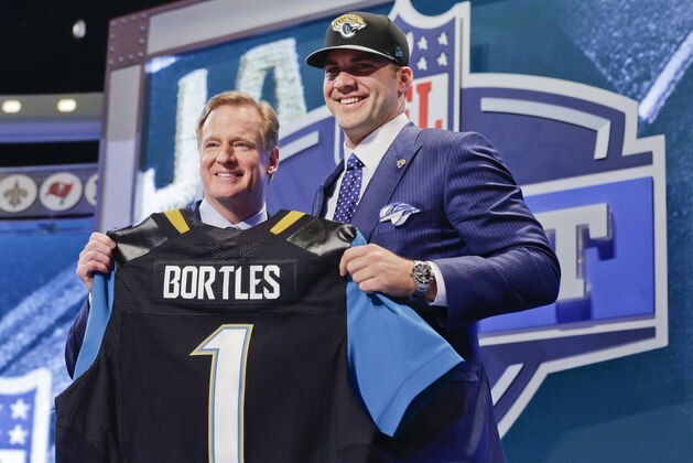 Central Florida quarterback Blake Bortles poses with NFL commissioner Roger Gooddell after being selected as the third pick by the Jacksonville Jaguars in the first round of the 2014 NFL Draft, Thursday, May 8, 2014, in New York. (AP Photo/Craig Ruttle)