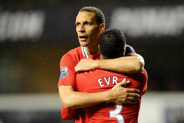 LONDON, ENGLAND - MARCH 04:  Rio Ferdinand of Manchester United hugs teammate Patrice Evra after victory in the Barclays Premier League match between Tottenham Hotspur and Manchester United at White Hart Lane on March 4, 2012 in London, England.  (Photo by Mike Hewitt/Getty Images)